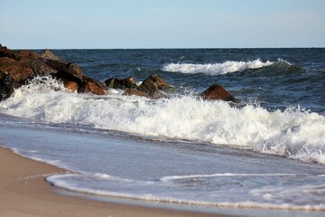 Waves crashing the rocks on the beach