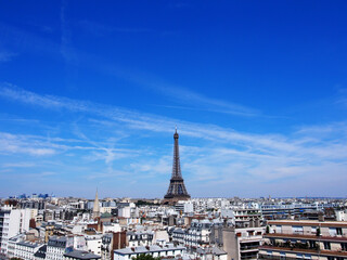 Paris skyline with the Eiffel Tower in the clear sky.