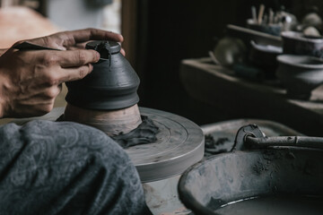 Artisan potter making art pot handicraft