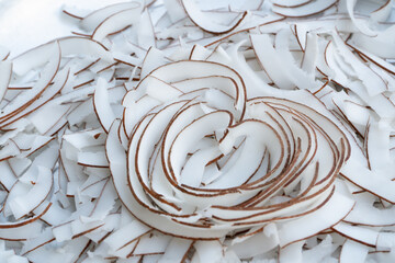Heart symbol,strip coconut flakes background pattern. Coconut lover concept.