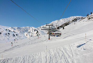 Fototapeta na wymiar Ski slopes in Austrian winter resort.