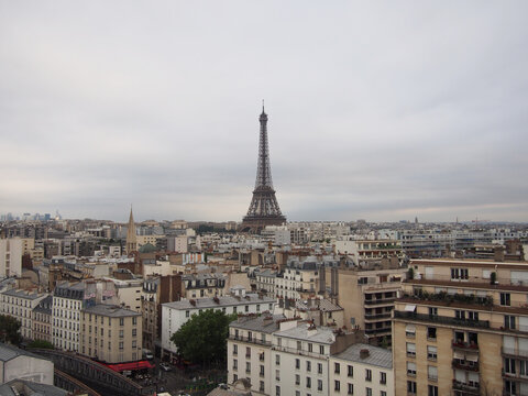 
Paris skyline with the Eiffel Tower on a cloudy cloudy day.