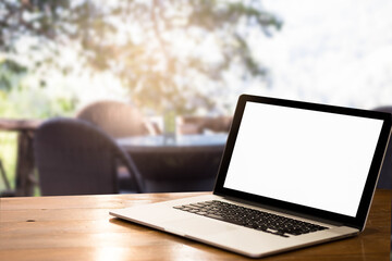 Blank screen laptop table  in the park.