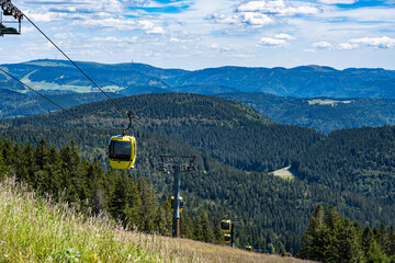 Beautiful view from the Mountain (Belchen) near Freiburg on the beautiful landscape of the Black Forest and the (Belchenbahn) ropeway.