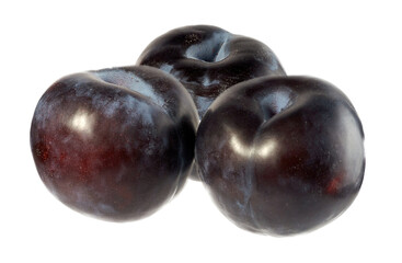 Three blue plums, isolated on a white background.