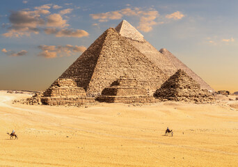 Pyramids of Giza in Egypt, sand dunes and bedouins