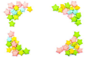 Corners for the frame of colorful paper stars in a children's style with an empty white place for text or image in the center. Template for scrapbooking.