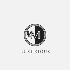 Circle M Letter Logo Icon. Classy Vintage Ornate Leaf Shape design on black and white color for business initial like fashion, jewelry, beauty salon, cosmetics, spa, hotel and restaurant