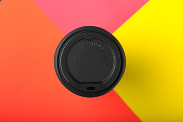 Take away coffee cup on colorful paper background