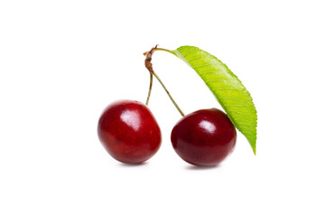Fresh cherries with leaf isolated on white background