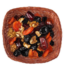 Dried fruits in basket isolated on white background