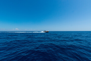 Expensive speedboat running over the guf of Naples.