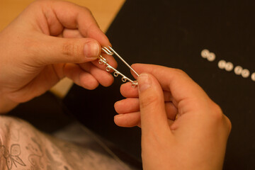 Creating handmade jewelry.