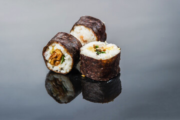 Three rolls of tasty and healthy fish, oriental national cuisine