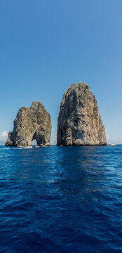 The majestic Faraglioni of the Capri Island.