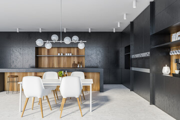 Black kitchen interior with bar and table