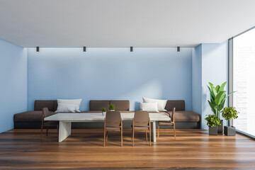 Blue dining room interior with sofa