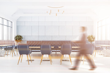 Man walking in blue cafe