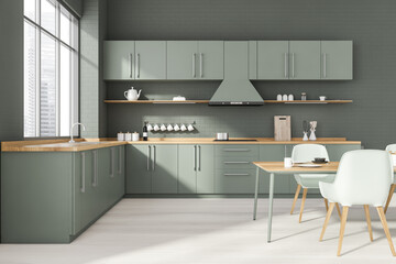Grey kitchen interior with dining table