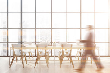 Man walking in panoramic dining room