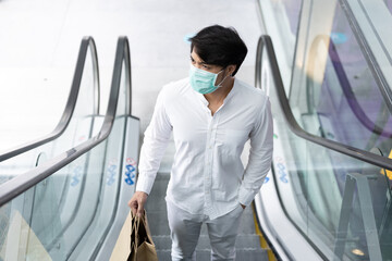 Asian young man wearing medical face mask, new normal life style