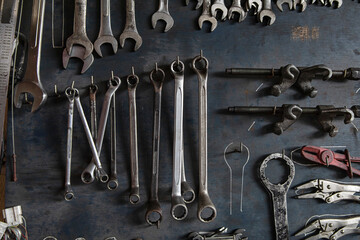 Wrench, Pliers, Clamps. A lot of tools mechanic on old wooden board background.