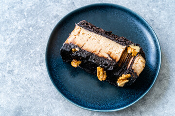 Peanut Butter Pie with Chocolate Mousse, Ganache Chocolate and Walnut Cooked with Coconut Sugar and Almond Flour.