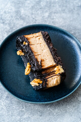 Peanut Butter Pie with Chocolate Mousse, Ganache Chocolate and Walnut Cooked with Coconut Sugar and Almond Flour.