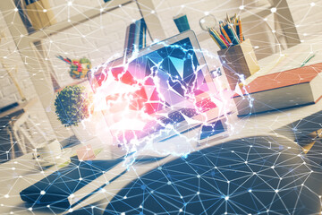 Double exposure of work space with computer and human brain drawing hologram. Brainstorm concept.