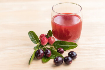 fresh Carissa carandas glass of juice with Carissa carandas fruits and Healthy drinks concept