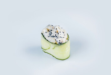 Japanese Gunkan Green Sushi with scallop and flying fish roe. Tobiko caviar, rice and scallop wrapped in cucumber. Side view Pan Asian dish Gunkan Maki isolated on gray background. Kappa nigiri

