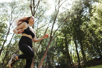 Sport, fitness, healthy lifestyle, cardio training. Active woman with athletic body running in the...