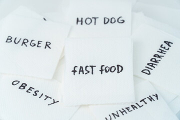 Obraz premium Toilet paper with text fast food. Concept of personal hygiene. Fast food Concept