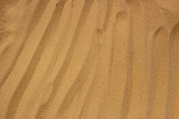 Background texture of clean yellow sand on the beach of Maldives.