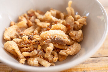Streaky pork with crispy crackling  in bowl