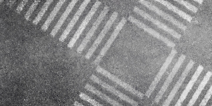 Abstract image aerial view of White pedestrian crosswalk or Zebra crossing on asphalt street road.