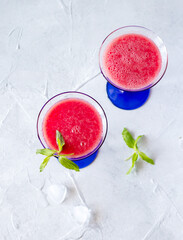 Watermelon smoothie with mint in glasses, summer refreshing drink. Top view