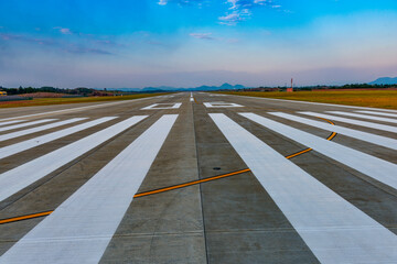  airstrip in the airport terminal with marking on blue sky