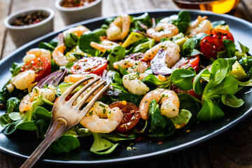 Prawn salad on wooden table
