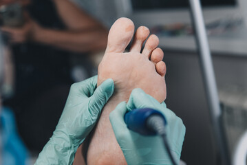 Peeling feet pedicure procedure in a beauty salon.