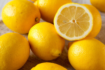 Fresh Ripe Yellow Organic Lemons on cloth, side view.