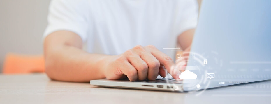 programmer man hand typing on keyboard for transfer or synch data upload and download from cloud computing with virtual interface in operation room, technology business concept	