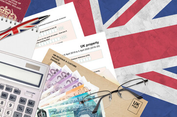 English Tax form sa105 UK Property from HM revenue and customs lies on table with office items....