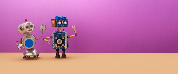 Two robots are looking away from themselves. Creative mechanical toys, steampunk style. Copy space for text on a purple-brown background.