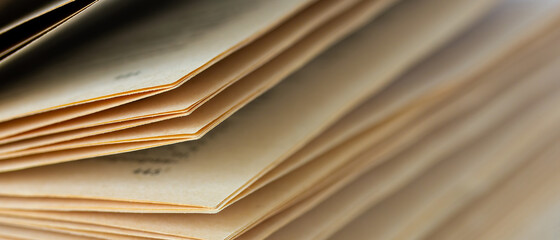 Macro view of book pages. Shallow depth of field.  Blurry. Toned image. Copy space for text.