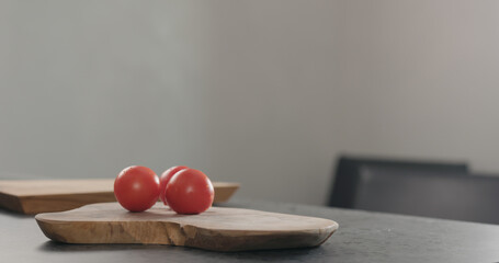 tomatoes on olive wood board