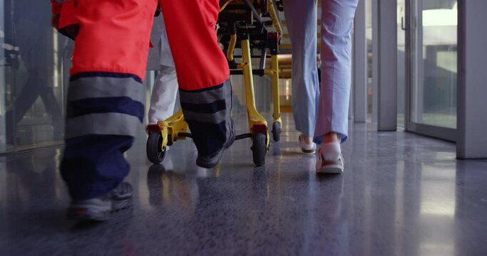 4K Slow Mo Close Up Of Nurses Legs Pushing Hospital Gurney