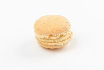 Light beige sweet macaroon on a white background