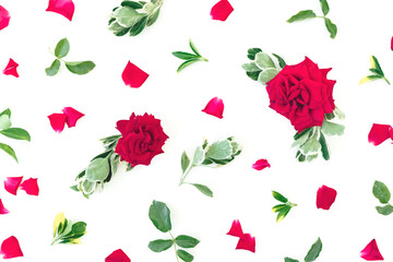 Flower pattern of red roses flowers and green leaves on white background. Flat lay