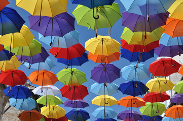 Fototapeta na wymiar Colorful umbrellas in the sky. Street decoration. Colorful background.